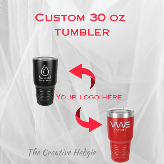 GPT A promotional graphic for customizable 30 oz tumblers, showcasing two examples against a white, translucent curtain backdrop. On the left, a sleek black tumbler with 'All Clean Spring Water' logo in white, and on the right, a vibrant red tumbler with 'WWE Tavern' logo in white. Large red arrows point to the center with text 'YOUR LOGO HERE,' indicating where a business can place their custom branding. The bottom text states 'The Creative Hedgie' as the promotional item provider.